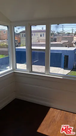 a view of two windows in a room