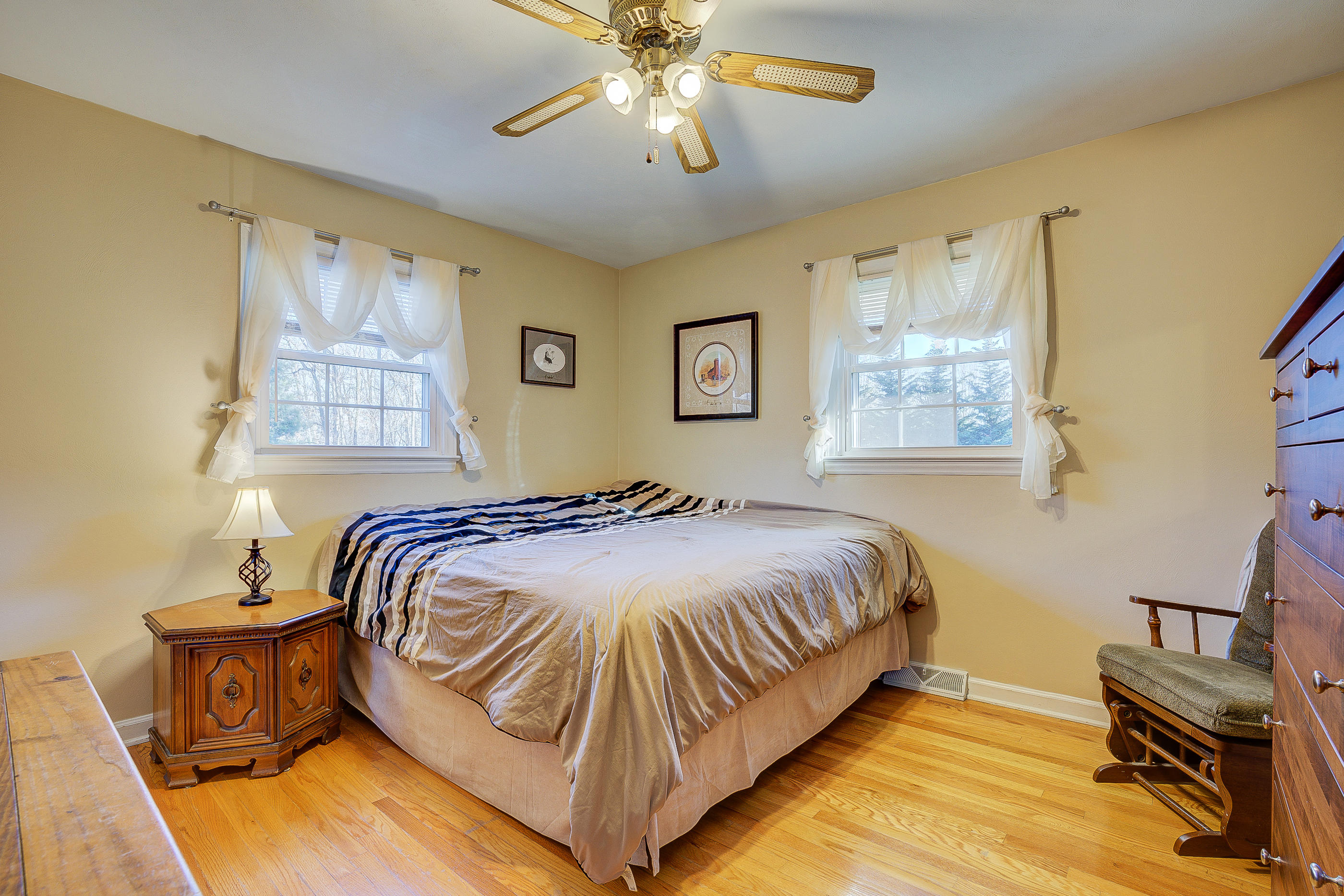 1905 Burma Road Salem, VA 24153 - Photo 20 of 26 a bedroom with a bed and a chandelier