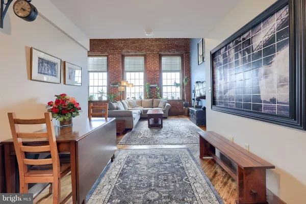 a kitchen with stainless steel appliances a stove microwave and refrigerator