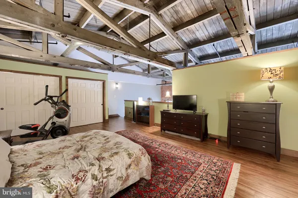 a bed room with a bed and a mirror