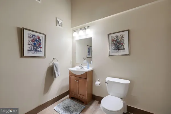a bathroom with a toilet and a shower curtain