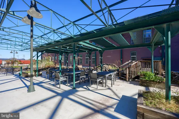 a view of a chairs and table in patio