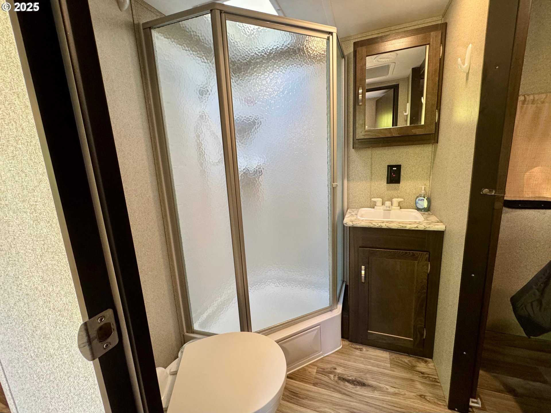 248 Horseshoe Bend Florence, OR 97439 - Photo 16 of 32 a bathroom with a sink a toilet a mirror and shower