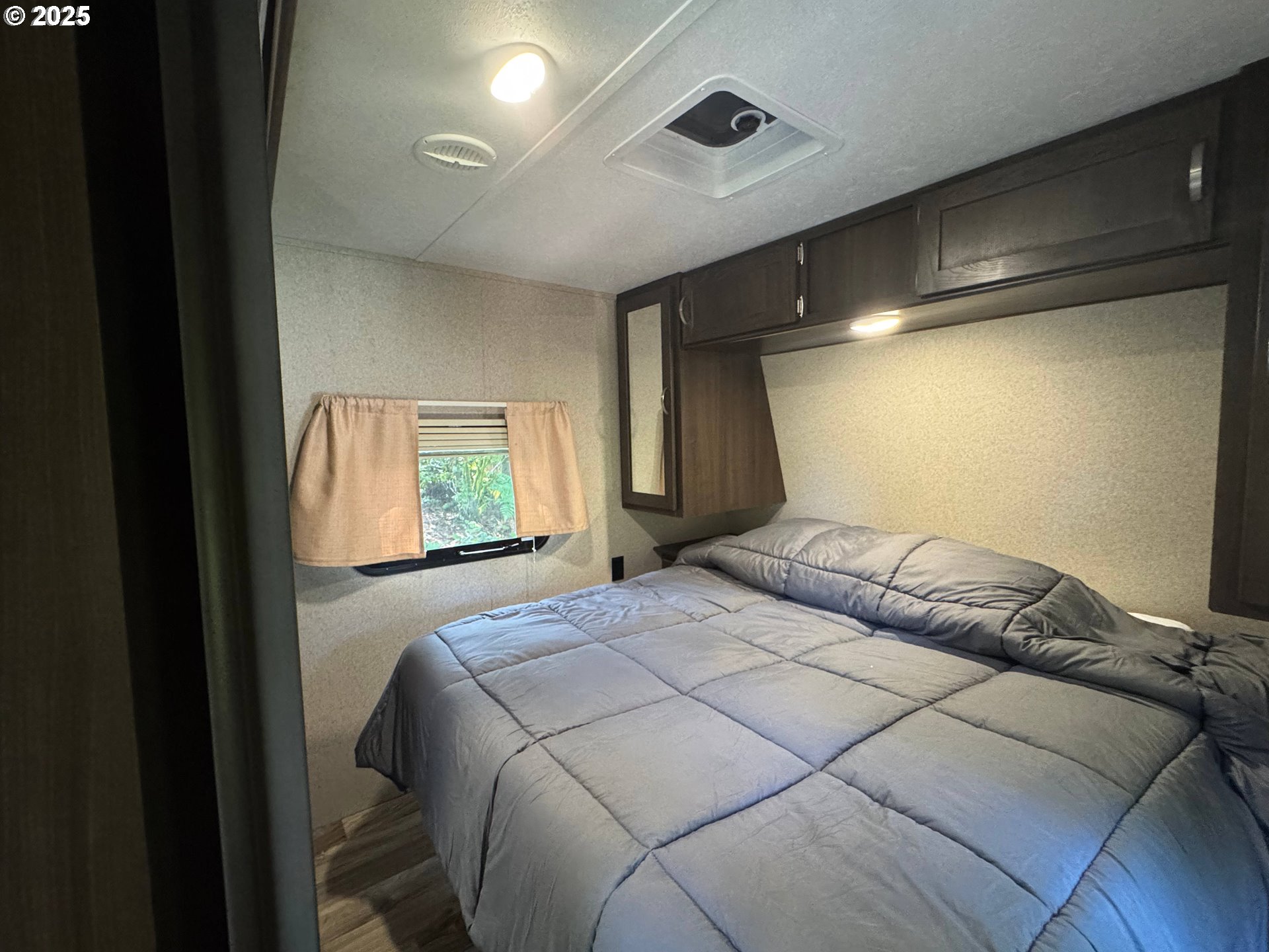 248 Horseshoe Bend Florence, OR 97439 - Photo 18 of 32 a bedroom with a bed and a window