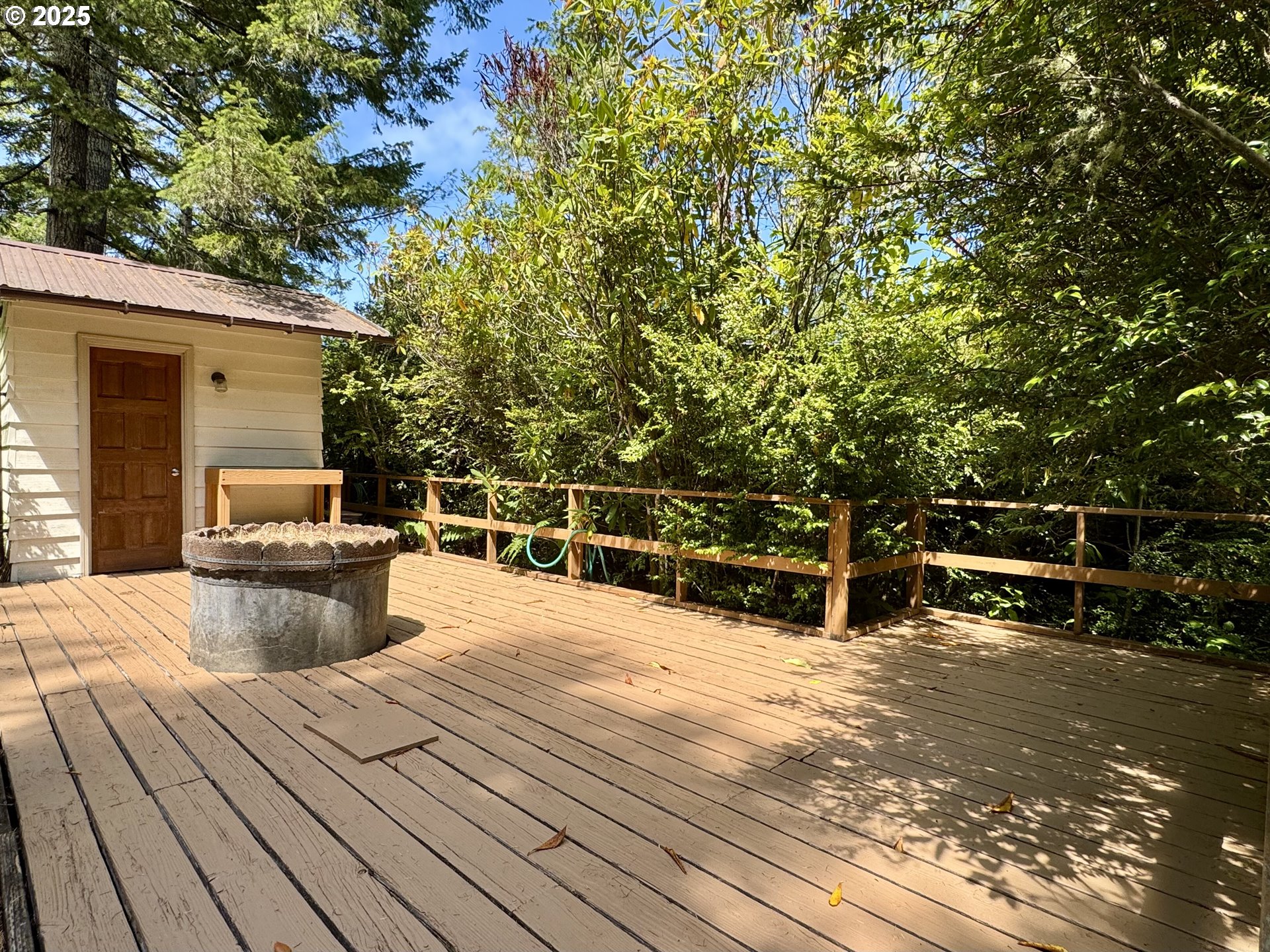 248 Horseshoe Bend Florence, OR 97439 - Photo 9 of 32 a view of a patio with wooden floor