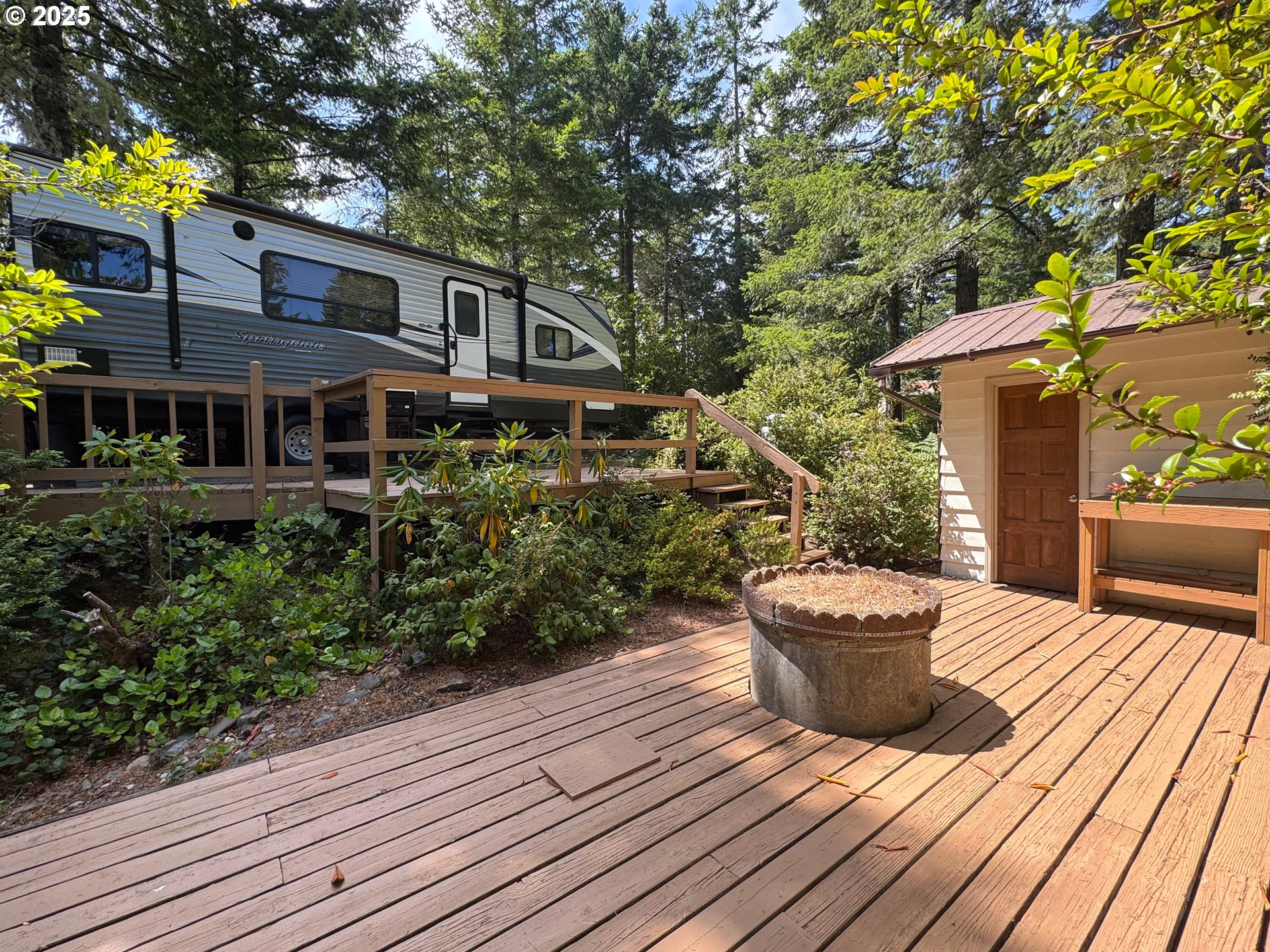 248 Horseshoe Bend Florence, OR 97439 - Photo 10 of 32 a view of a house with backyard and sitting area