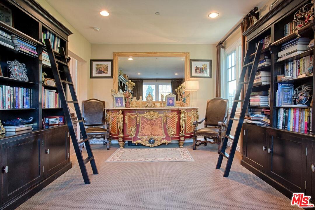 423 Woodbluff Road Monte Nido, CA 91302 - Photo 14 of 31 a view of a livingroom with furniture and a bookshelf