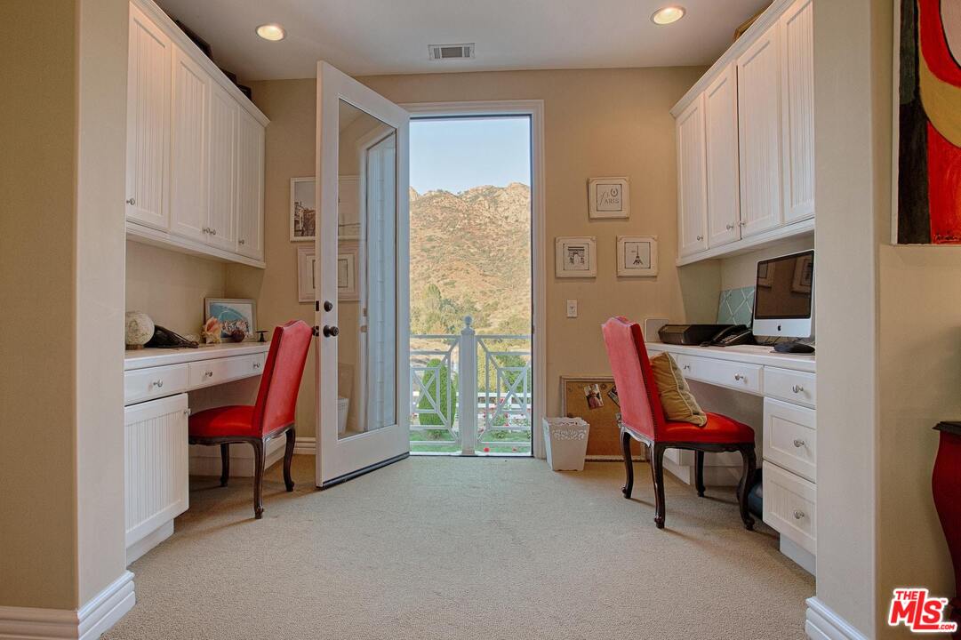 423 Woodbluff Road Monte Nido, CA 91302 - Photo 22 of 31 a room with furniture and a window