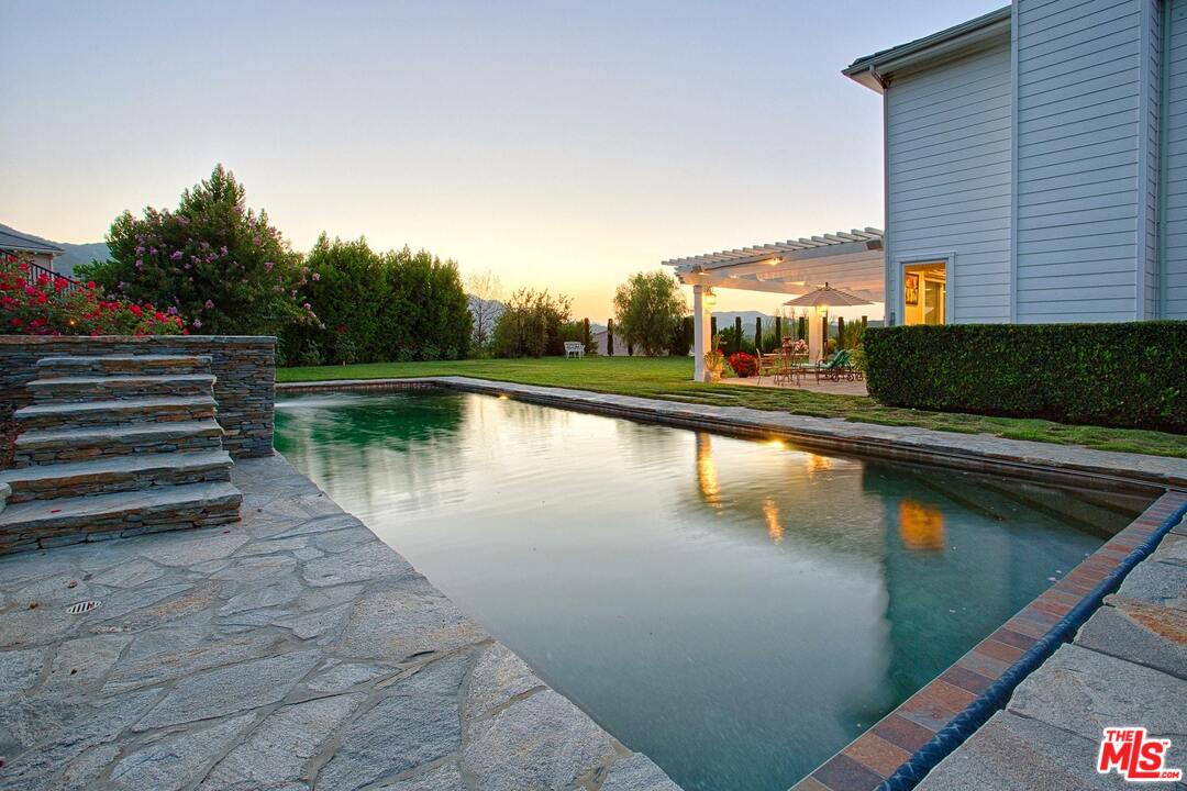 423 Woodbluff Road Monte Nido, CA 91302 - Photo 27 of 31 a view of a lake with a yard