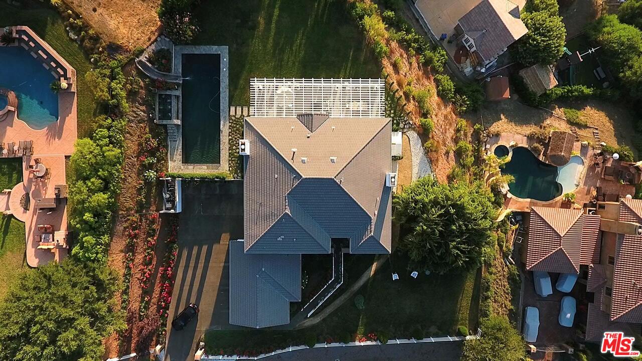 423 Woodbluff Road Monte Nido, CA 91302 - Photo 28 of 31 an aerial view of a house with a garden