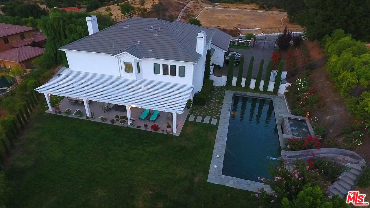 423 Woodbluff Road Monte Nido, CA 91302 - Photo 29 of 31 a aerial view of a house next to a yard
