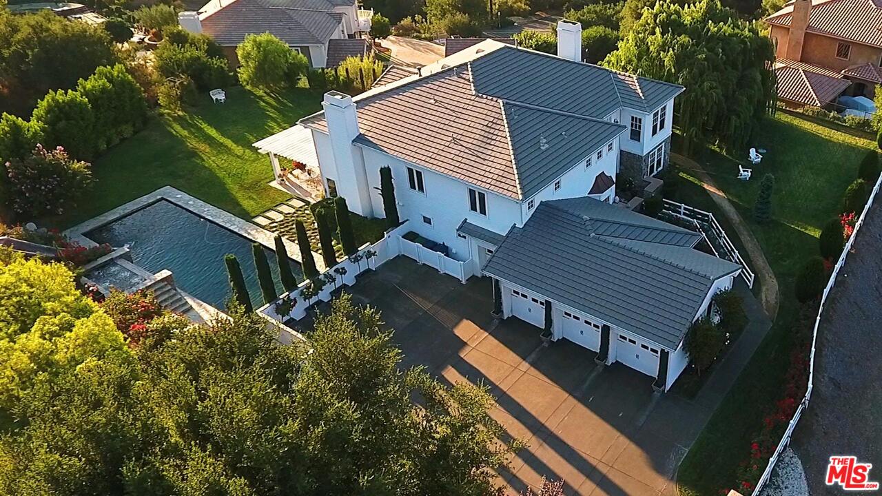 423 Woodbluff Road Monte Nido, CA 91302 - Photo 30 of 31 a view of a house with a yard