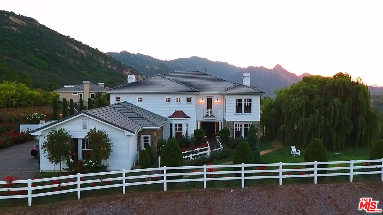 423 Woodbluff Road Monte Nido, CA 91302 - Photo 31 of 31 a view of a house with a yard