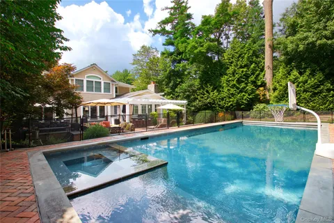 a front view of a house with swimming pool