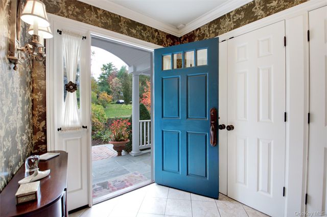 a view of an entryway with wooden floor