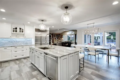 a kitchen that has a lot of cabinets in it