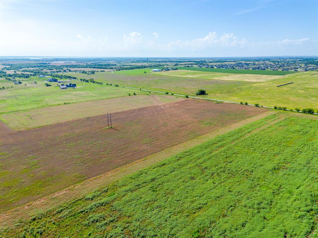 6785 Hoehn Road Valley View, TX 76272 - Photo 9 of 14 Expansive rural landscape featuring a mix of cultivated fields and open pastures
