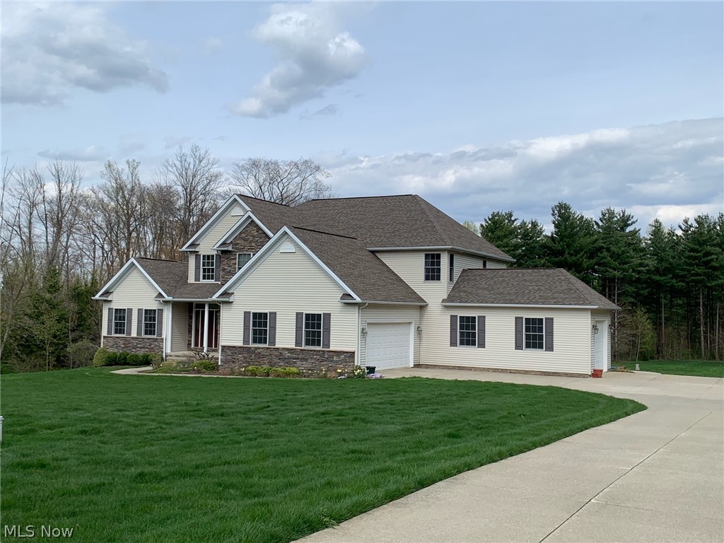 12395 Falcon Ridge Road Chesterland, OH 44026 - Photo 34 of 35 Note: Concrete Driveway, 3-Car Attached Garages with Private Views! WELCOME HOME!