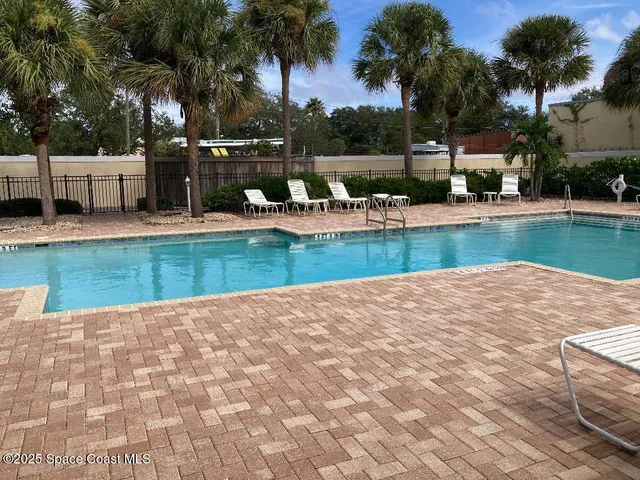 a view of a swimming pool with a patio