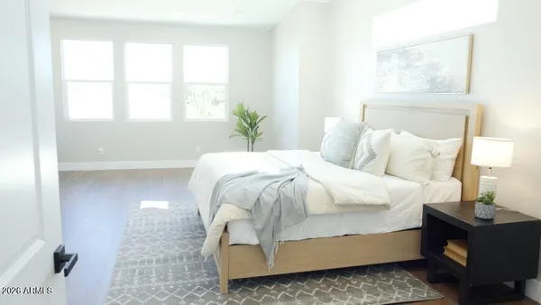 a bedroom with a bed and window