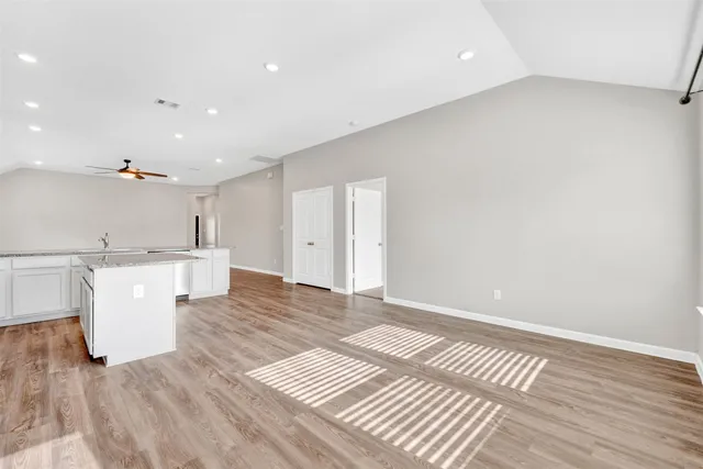 a view of kitchen with furniture and wooden floor