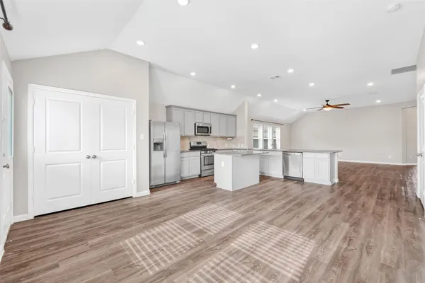 a view of kitchen with wooden floor