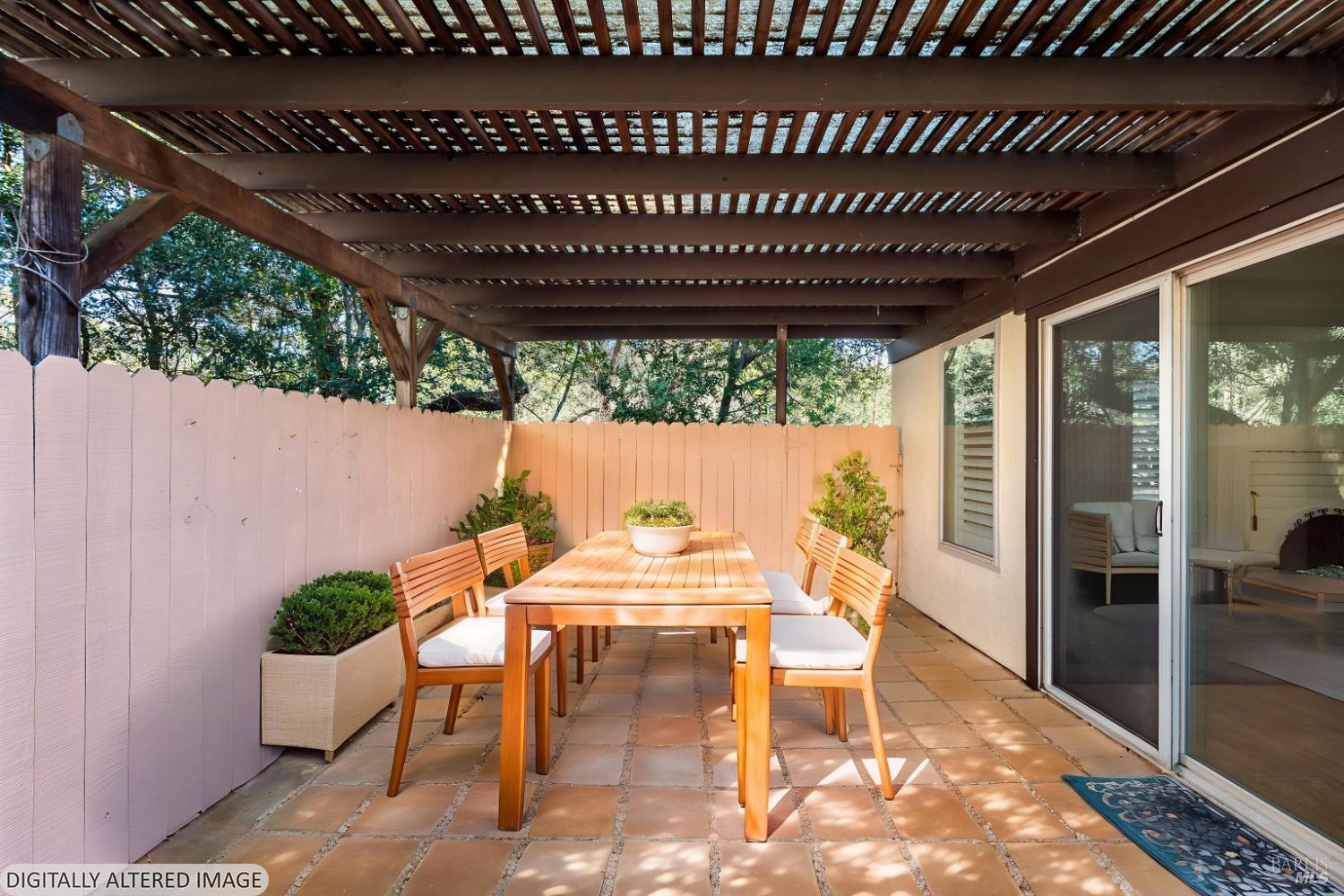 826 Adobe Drive Santa Rosa, CA 95404 - Photo 6 of 32 a view of a patio with table and chairs and potted plants