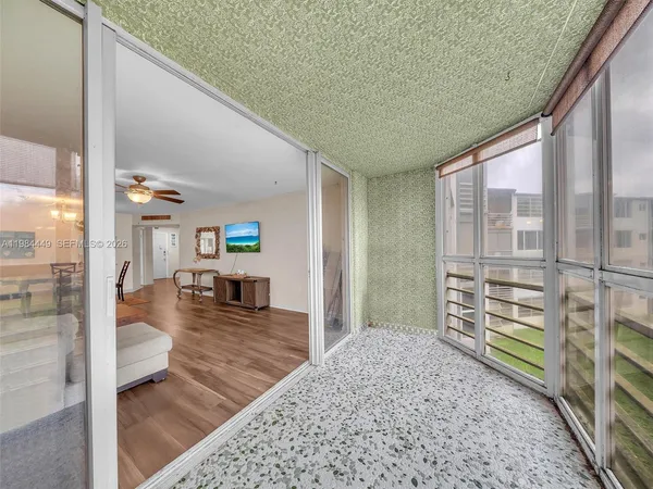 a view of a living room and a wooden floor