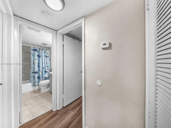 a bathroom with a glass shower door