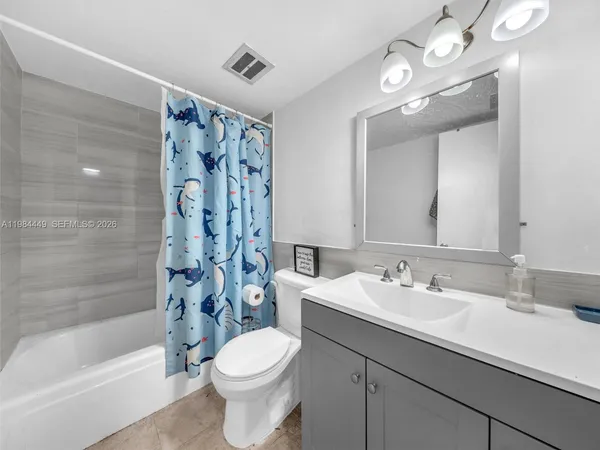 a bathroom with a sink a toilet and a bathtub