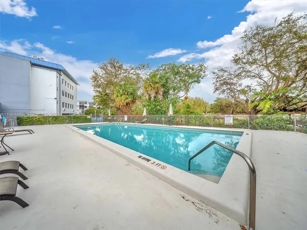 a view of swimming pool with a yard