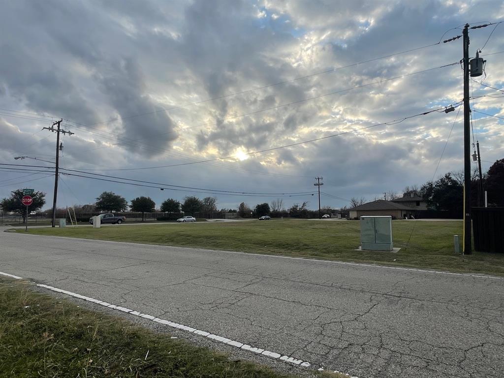201 Swisher Road Lake Dallas, TX 75065 - Photo 3 of 4 a view of a golf course with a lake