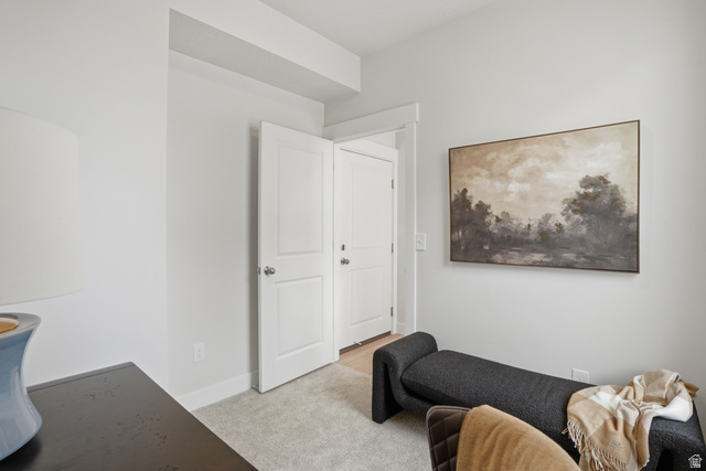 7338 South Seven Tree Lane, Unit 75 Midvale, UT 84047 - Photo 6 of 30 Sitting room featuring light colored carpet and baseboards