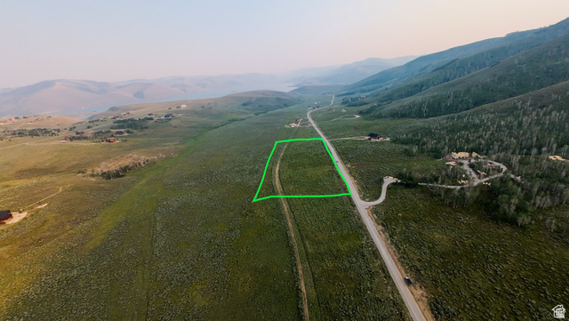 55 North Dry Valley Road, Unit 65 Helper, UT 84526 - Photo 1 of 7 Expansive land parcel featuring a green-lined boundary, adjacent to a paved road