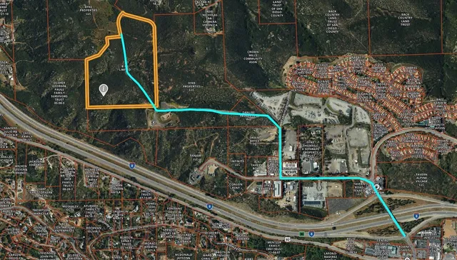 a view of swimming pool with a garden and plants