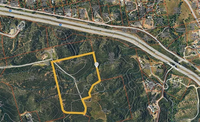 a blue and white view of a backyard