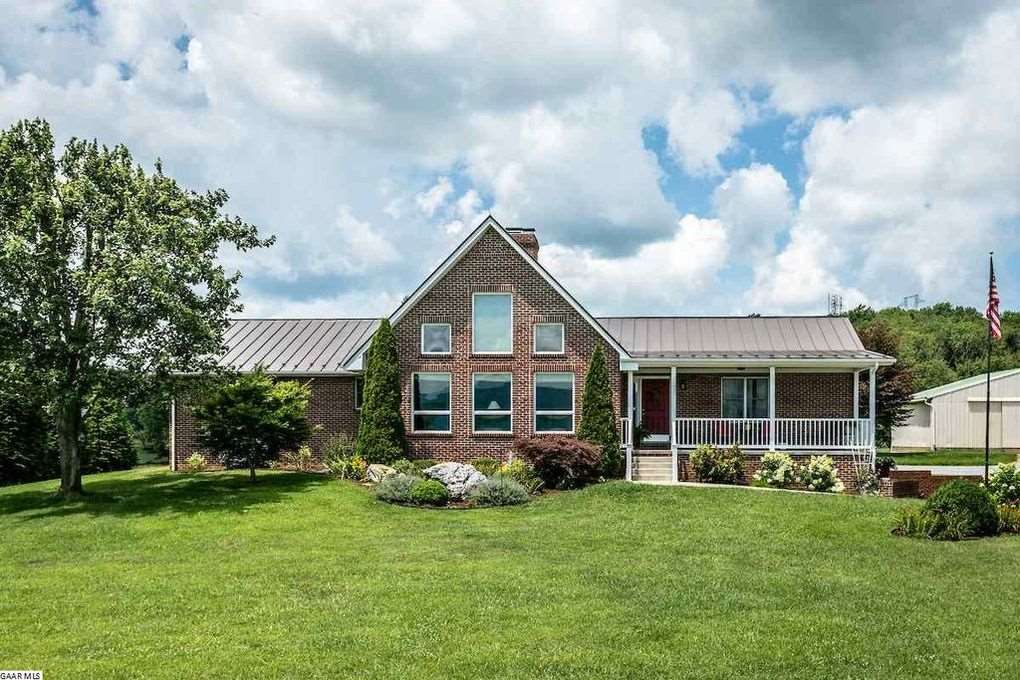 385 Howardsville Road Staunton, VA 24401 - Photo 1 of 1 a front view of a house with a yard and green space