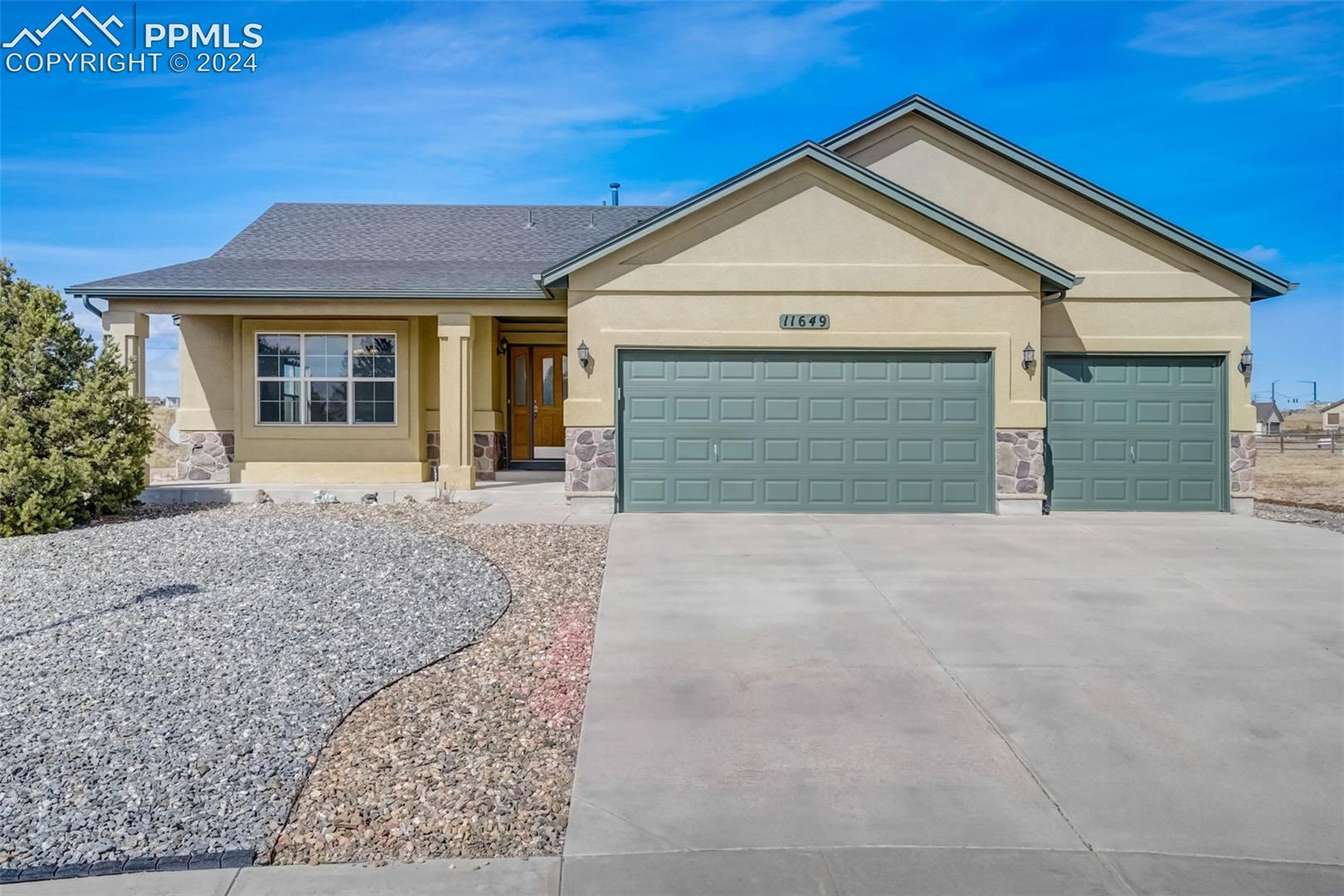 Ranch-style house with a 3 car garage