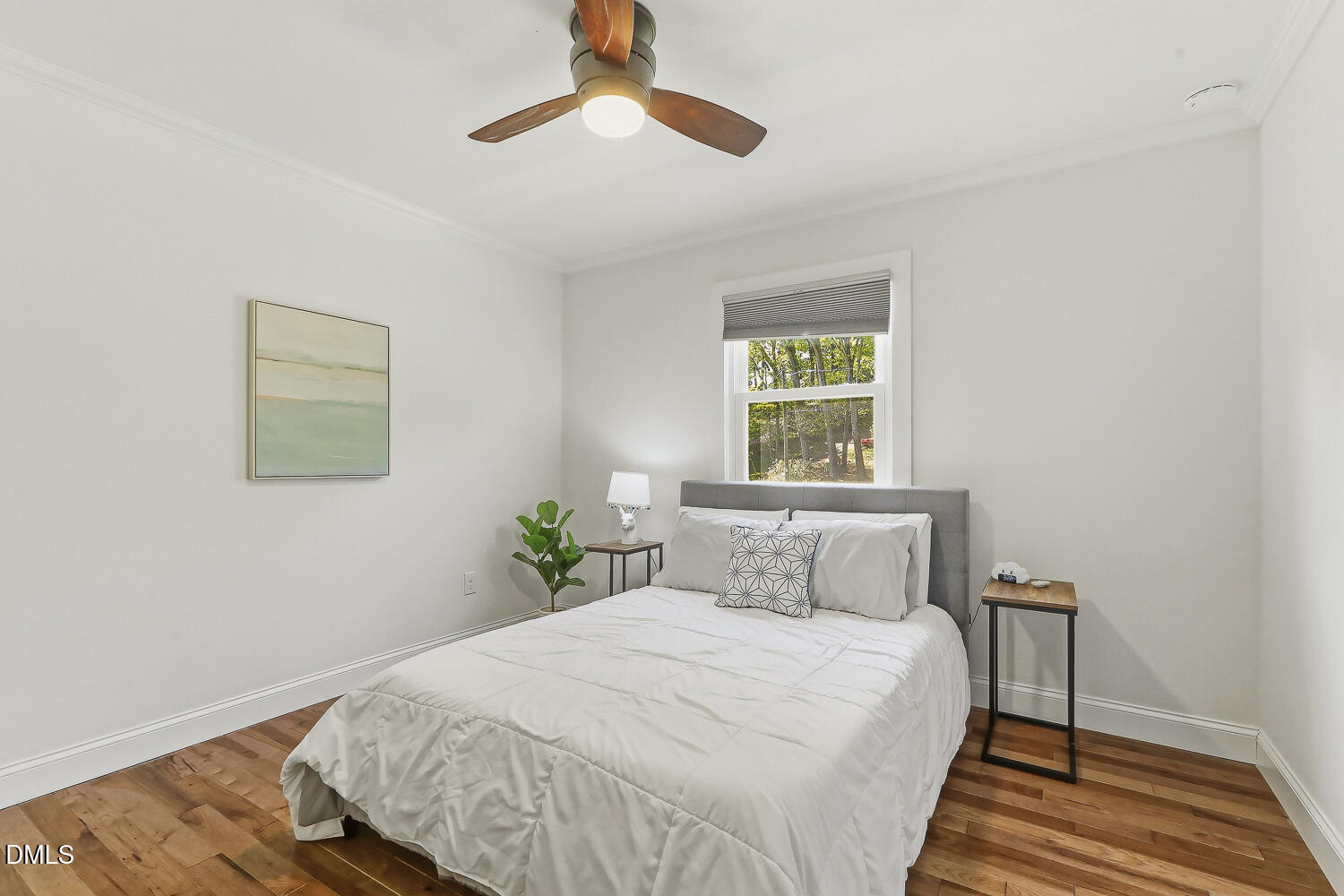 3704 Swann Street Raleigh, NC 27612 - Photo 15 of 21 a bedroom with a bed and a window