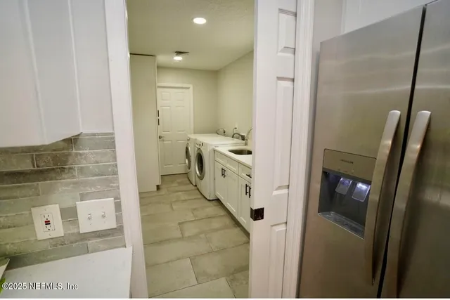 a bathroom with a mirror and a shower
