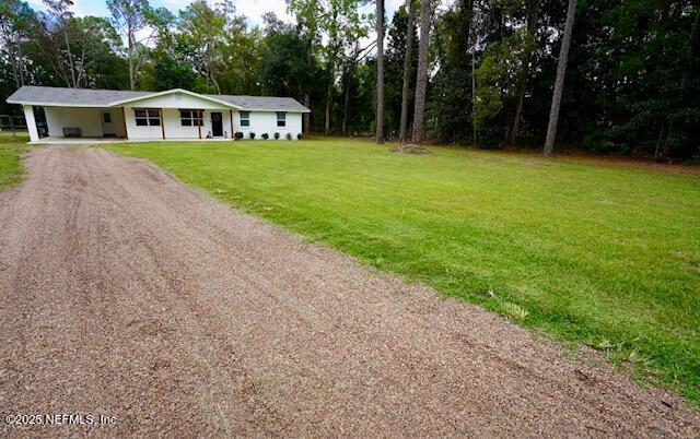 54376 Lisa Drive Callahan, FL 32011 - Photo 32 of 32 a front view of a house with a garden