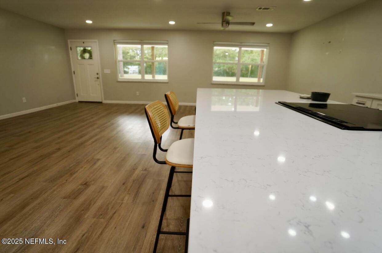 54376 Lisa Drive Callahan, FL 32011 - Photo 10 of 32 a workspace with wooden floor and windows