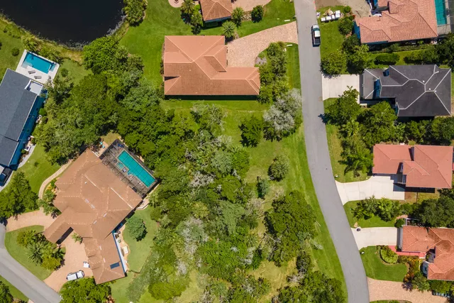 an aerial view of house with yard