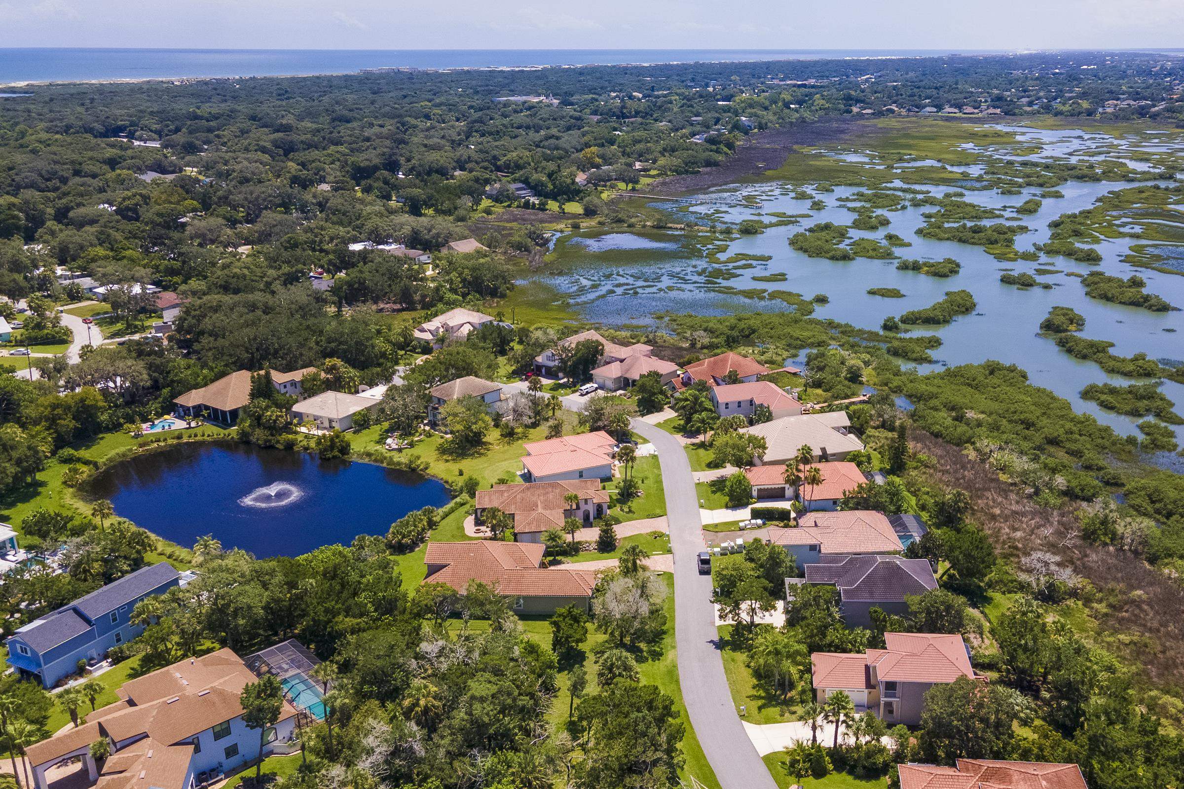 113 Spoonbill Point Court St. Augustine, FL 32080 - Photo 18 of 52 an aerial view of residential houses with outdoor space and trees