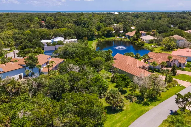 an aerial view of residential houses with outdoor space