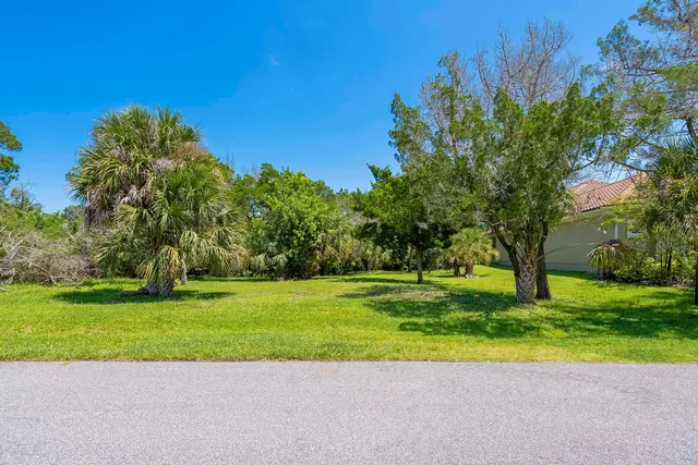 a view of a golf course with a big yard