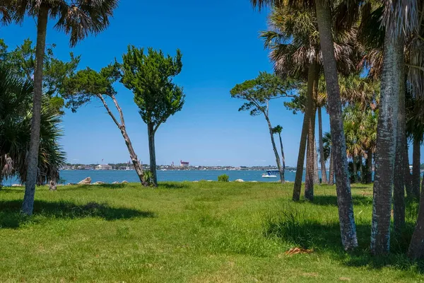 a view of a lake with a yard