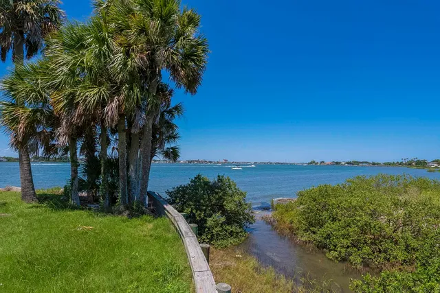 a view of a lake with a house in background