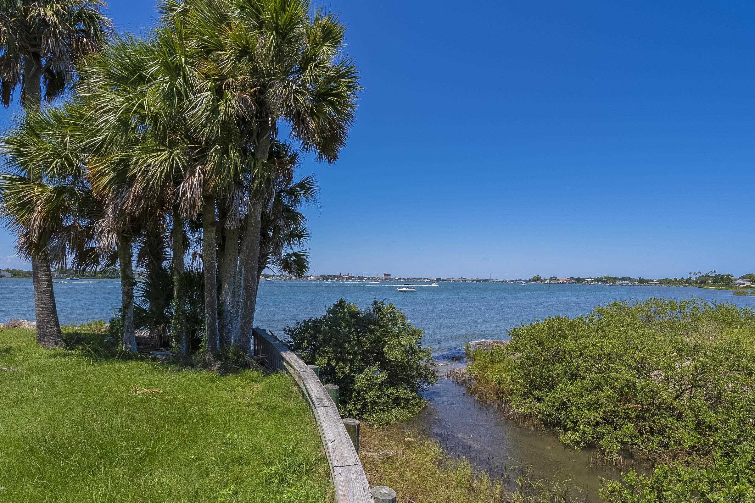 113 Spoonbill Point Court St. Augustine, FL 32080 - Photo 35 of 52 a view of a lake with a yard