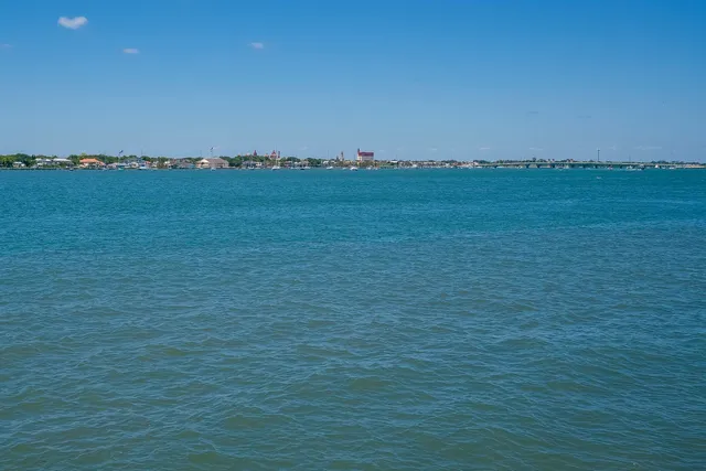 a view of swimming pool with a yard and seating area